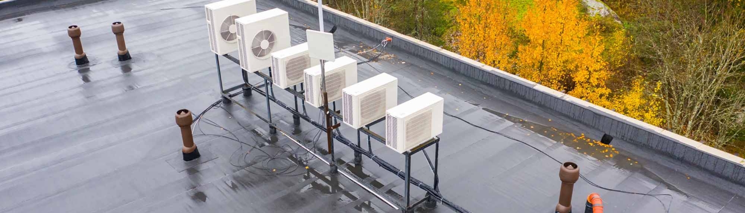 Outdoor air conditioning units on roof. Air conditioning system opens onto roof_